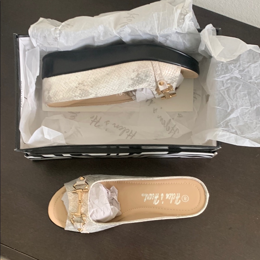 Helen Heart Cream and Black Wedge Mules for Effortless Elegance.
RUNS SMALL.